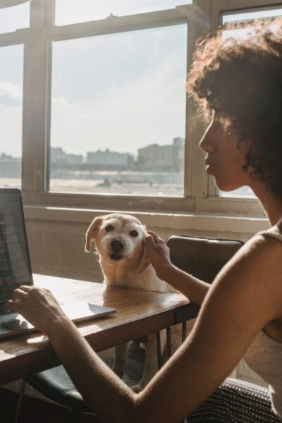 Lady with dog while working