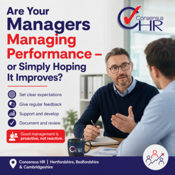 Poster reading 'Are Your Managers Managing Performance—or Simply Hoping It Improves?' with two men discussing at a desk and the Consensus HR logo nearby.
